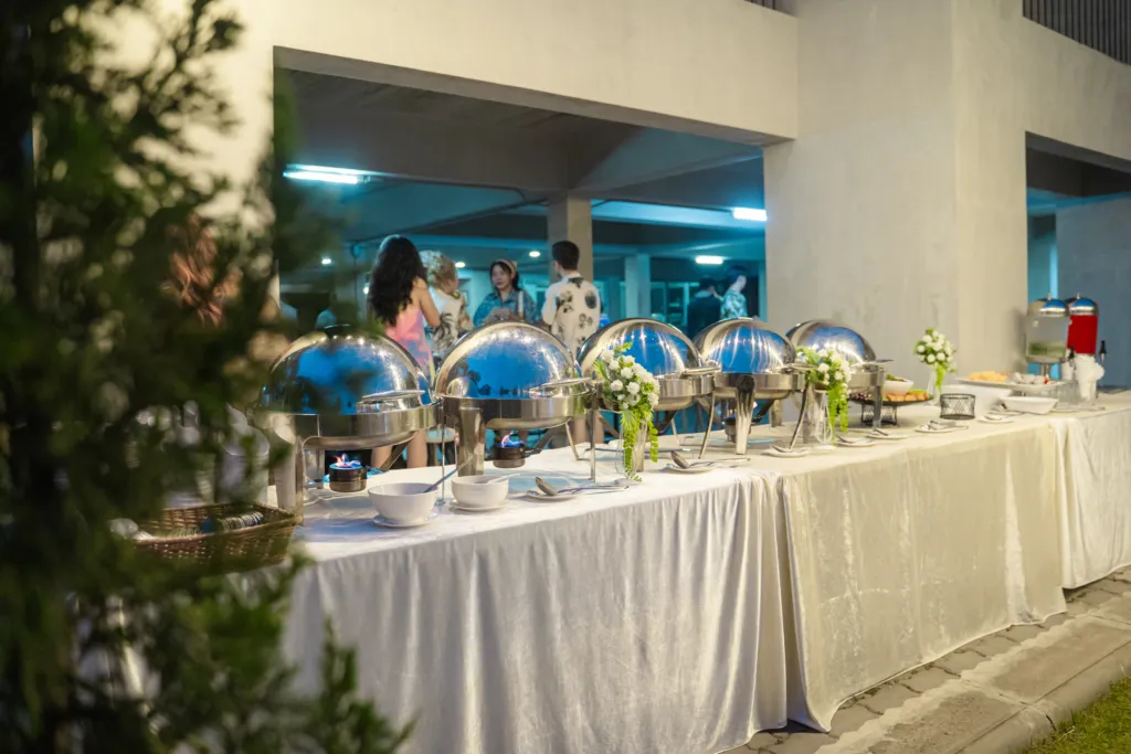 Outdoor buffet setup at an evening event.