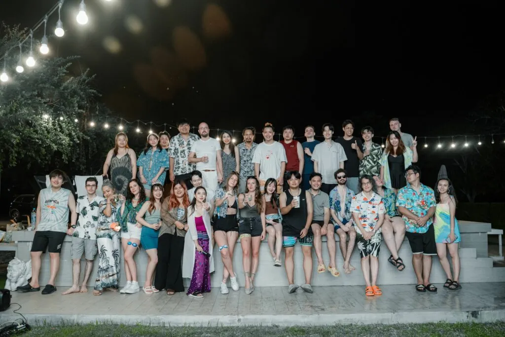 Group of people at outdoor nighttime party.