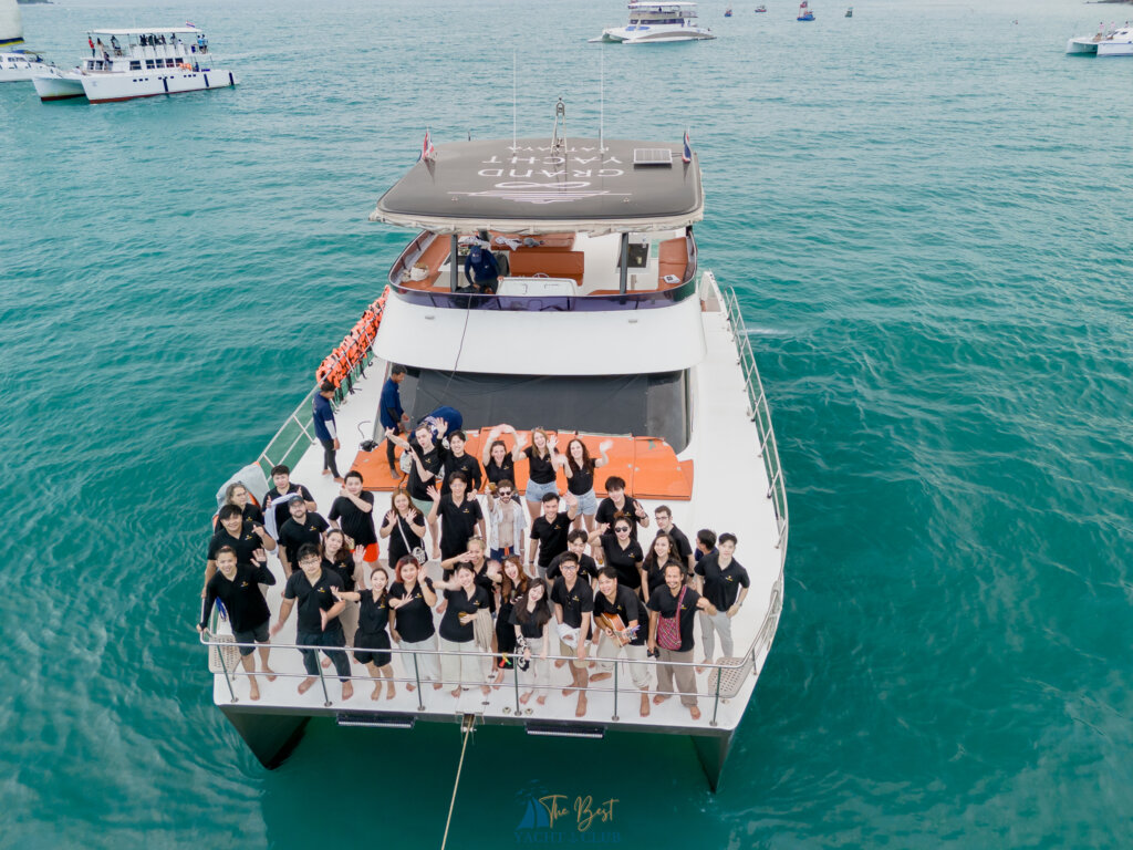 Group of people gathered on yacht deck at sea